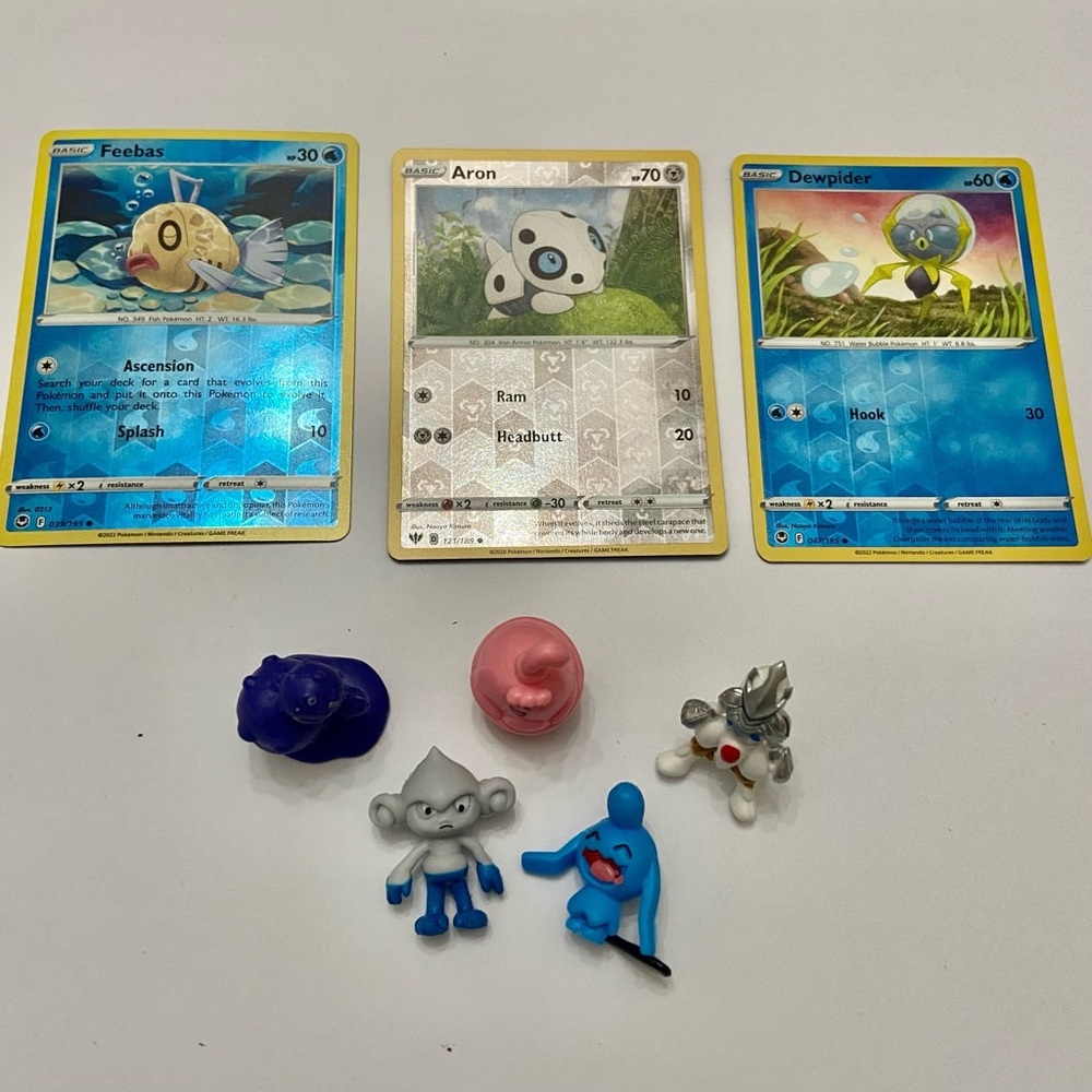 Lot (C): 3 Pokemon Reverse Holo Cards and 5 Pokemon Figures
